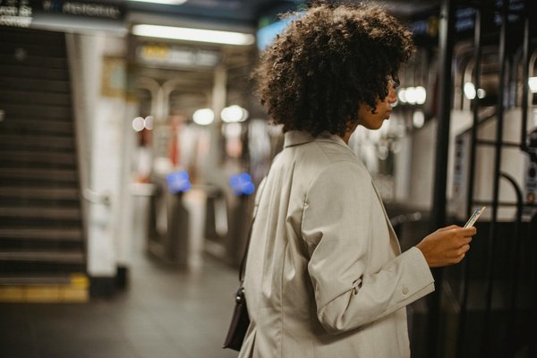 How can you travel across the UK affordably by train?